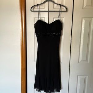 S.L. Fashions Black Dress with a Beaded Accent
